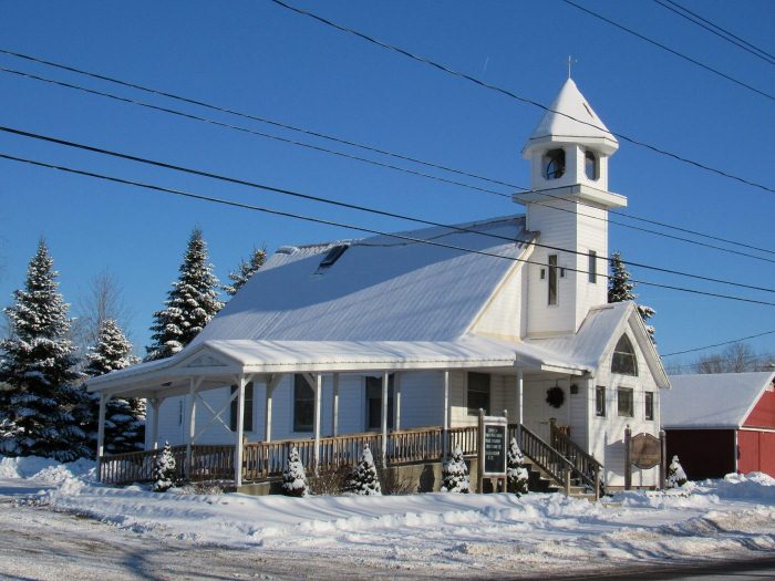 church in the snow with a blue sky